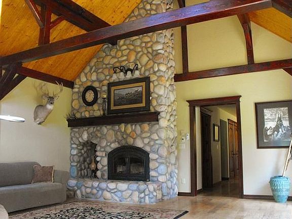Main living area with streamstone fireplace.
