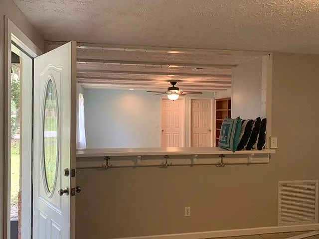 bar height entry way counter and living room view