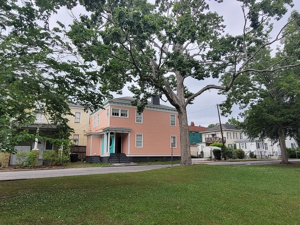 View of Duplex from Dixon Park across Java Place. Lane to the right, parking spot/patio to the left.