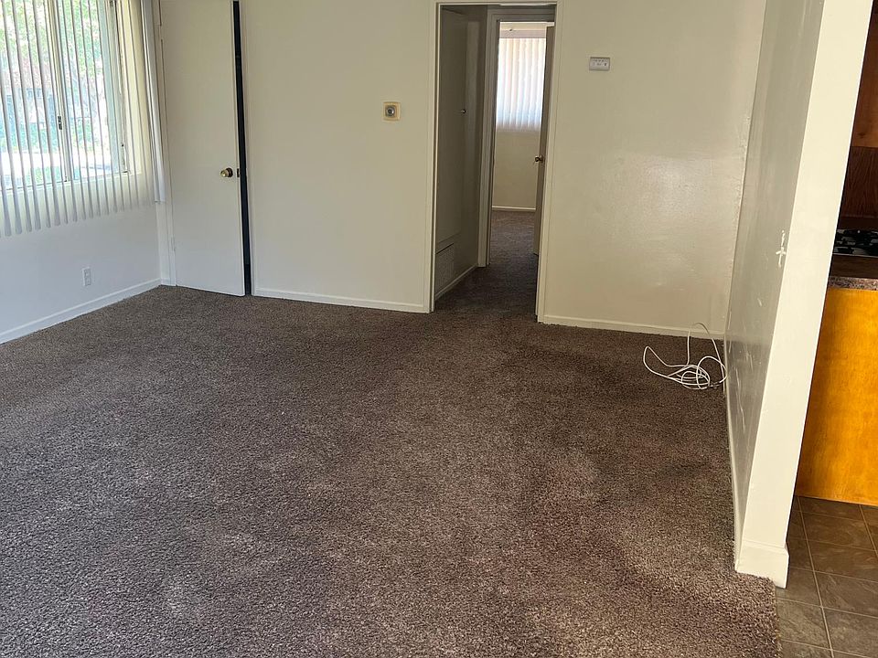 Living room. Carpet throughout.