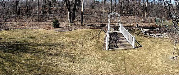 Big back yard is well buffered from roadway with sound wall, berm, fence & lot