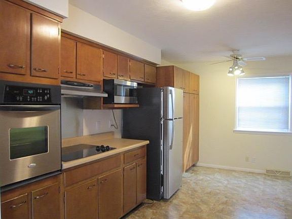 Kitchen has lots of storage and pantry cabinets.