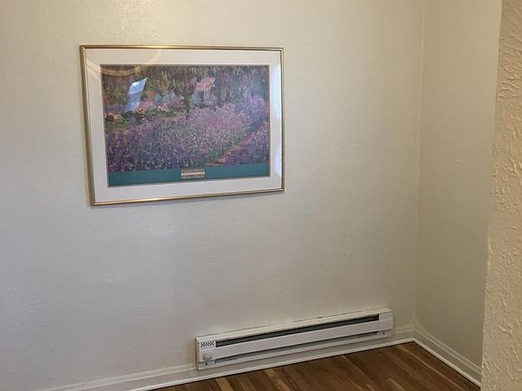 Bedroom with ceiling fan and north facing window.