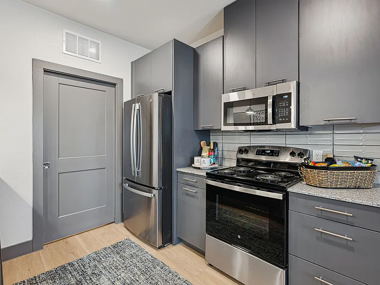 Kitchen with Gray Cabinets and Stainless Steel Appliances