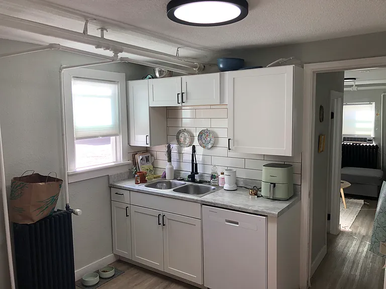Spacious Kitchen w South facing window.
