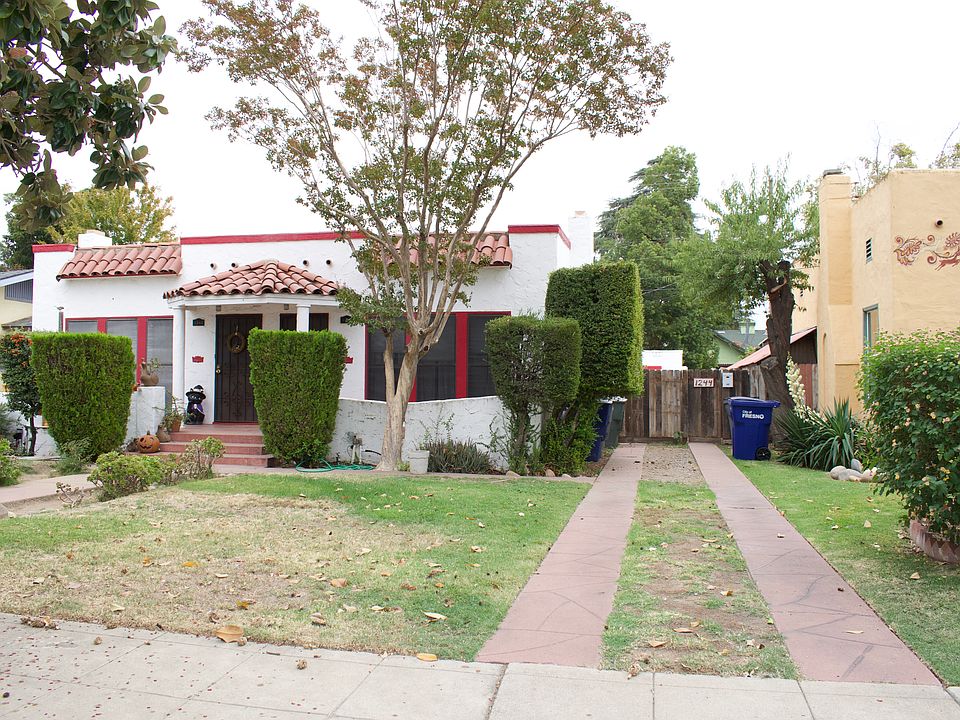 Duplex with small house in rear. Take path on right of property.