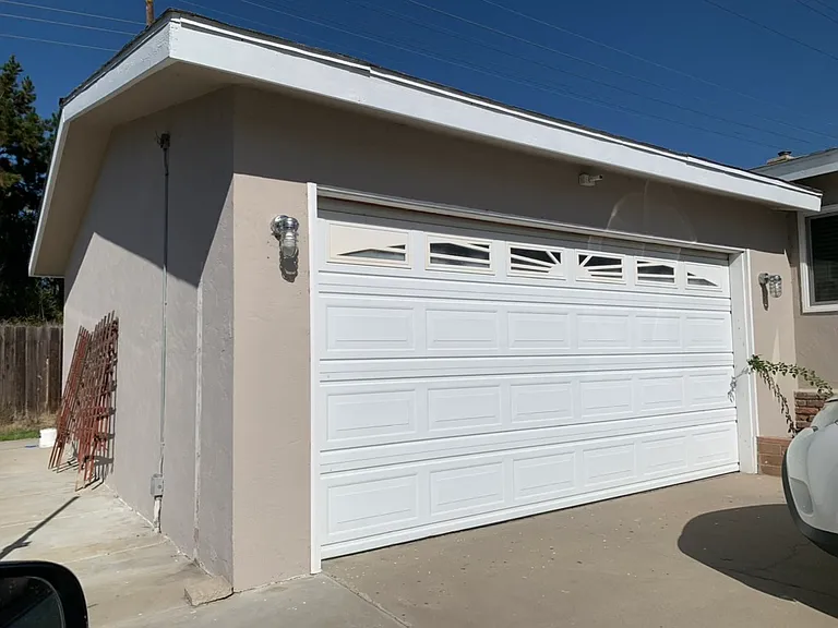 Attached garage, accessible via patio door.