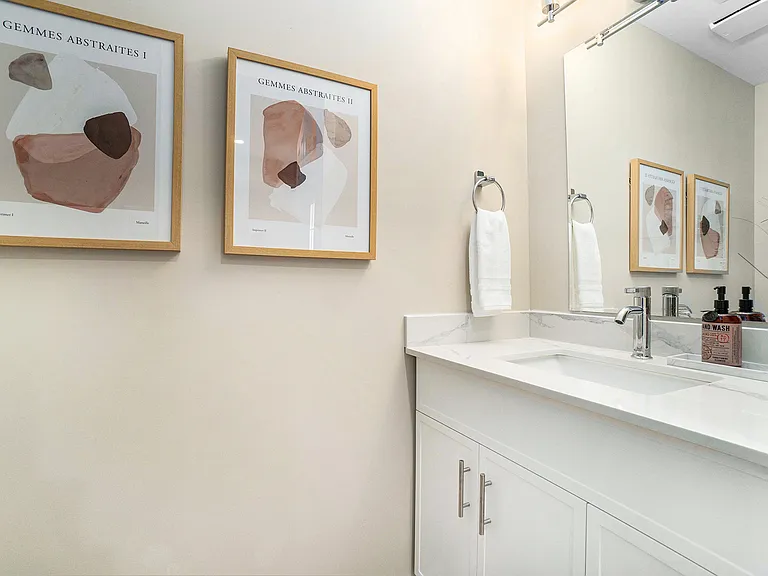 Bright and clean bathroom vanity with modern fixtures in our Ottawa rental property.