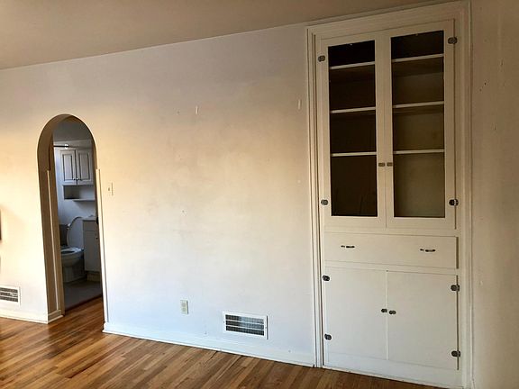 Living room looking toward the bathroom and kitchen area