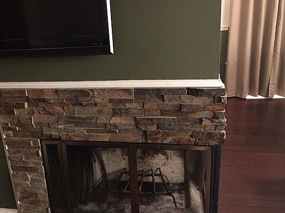 Wood burning fireplace in living room