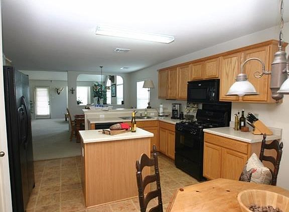 Kitchen opens to the breakfast room and formal dining. There's even a elevated breakfast bar that's 