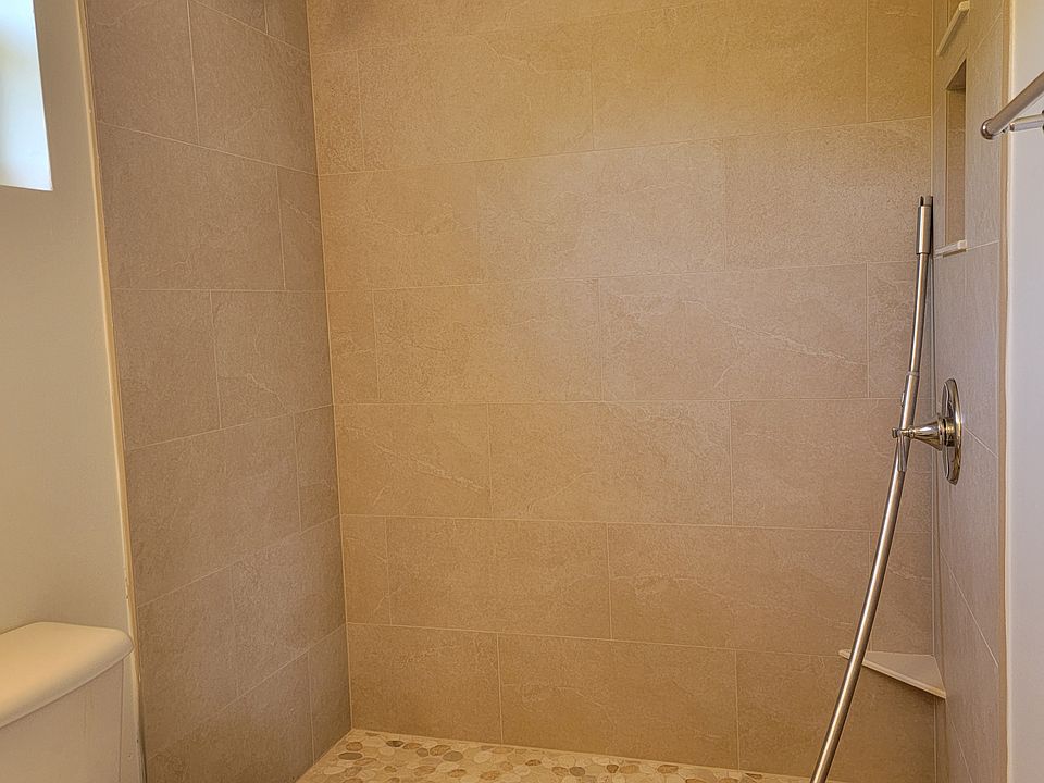 BRAND NEW tile shower with niches and a shaving ledge! (Glass door coming)