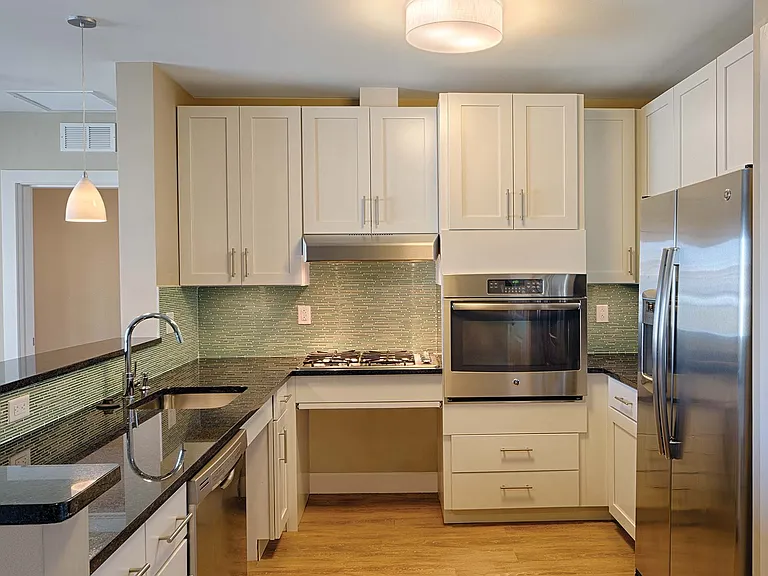 Select kitchens feature granite countertops, stainless steel appliances, designer cabinets, and a convection oven