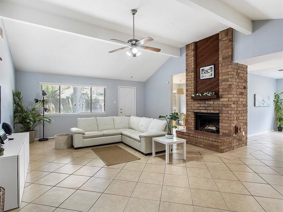 Lots of natural light in living area with high ceilings.