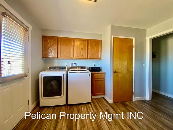 Laundry area with door to back yard, fully fenced 
Samsung washer and dryer