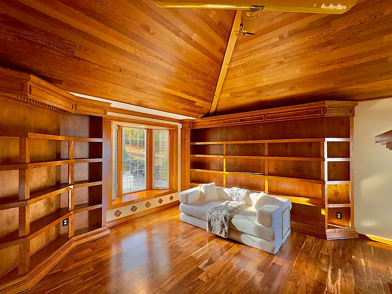 A library/den provides a quiet retreat for reading, working, or simply relaxing with a view_ideal for balancing leisure and productivity