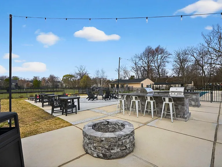 Unwind and enjoy the vibrant outdoor space at Eagle Rock Apartments at Mohegan Lake, featuring modern seating and a cozy fire pit. Perfect for gatherings with friends or relaxing evenings. Secure your spot today!