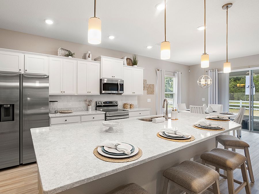 Model home for sale in Lake Alfred with 3 bedrooms plus a den and luxe finishes!