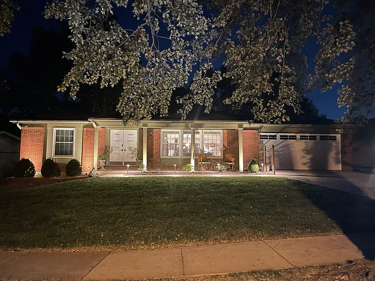 Night time view of house with beautiful exterior lighting