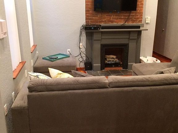 exposed brick in the kitchen, living room and bedroom