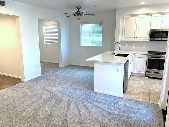 Dining area and Den to the left, perfect for office or guest room.