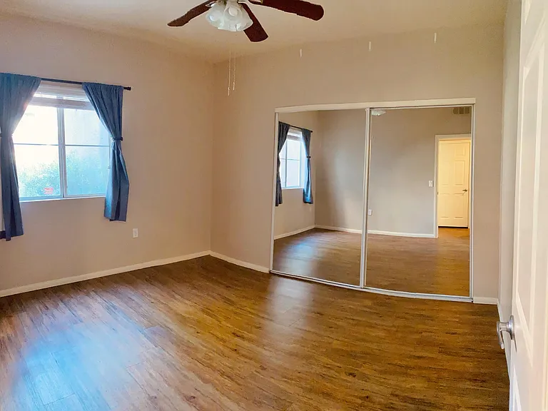 Double closet mirrors in 2nd bedroom