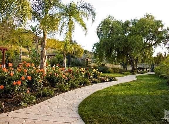 The pathway to the separated pen area, where you'll find two outbuildings including water and electr