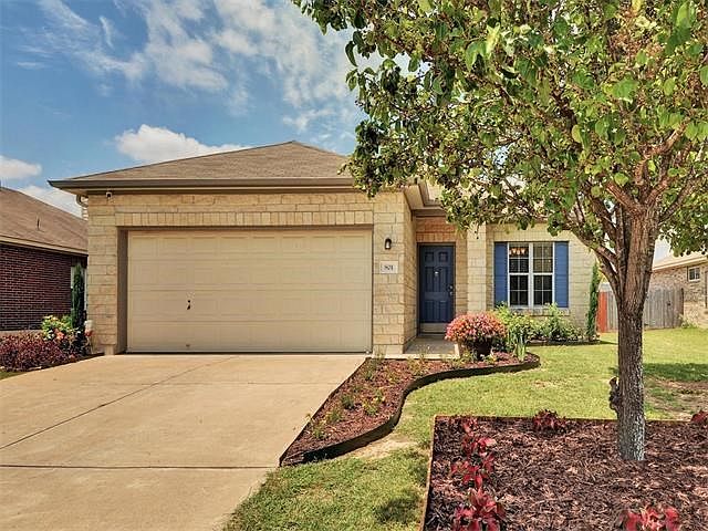 Exterior front view, nicely landscaped front and back yard.
