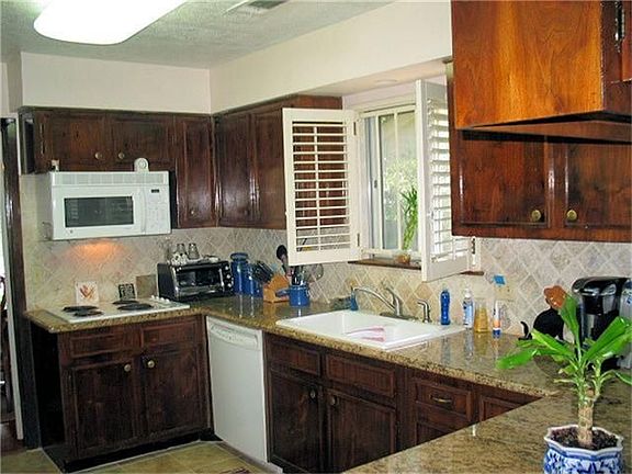 Kitchen Features Granite Counters & Tile Back Splash