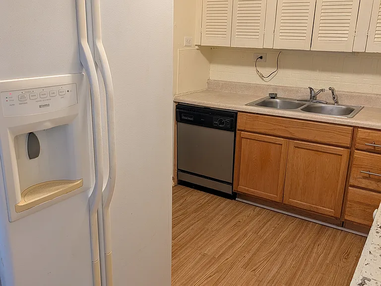 Kitchen with double door refrigerator and double sink