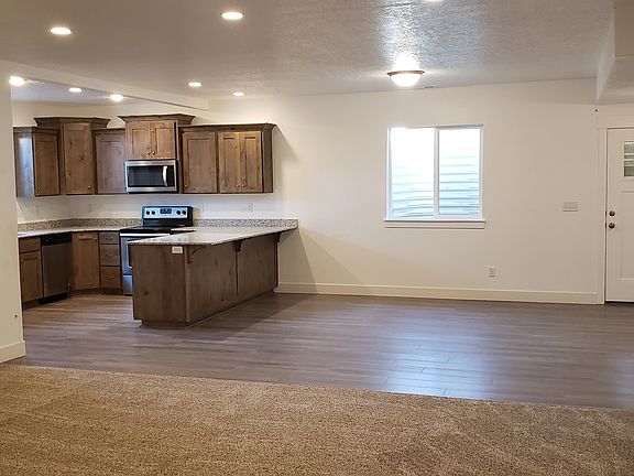 Image from living/family room towards dining room/kitchen and entrance