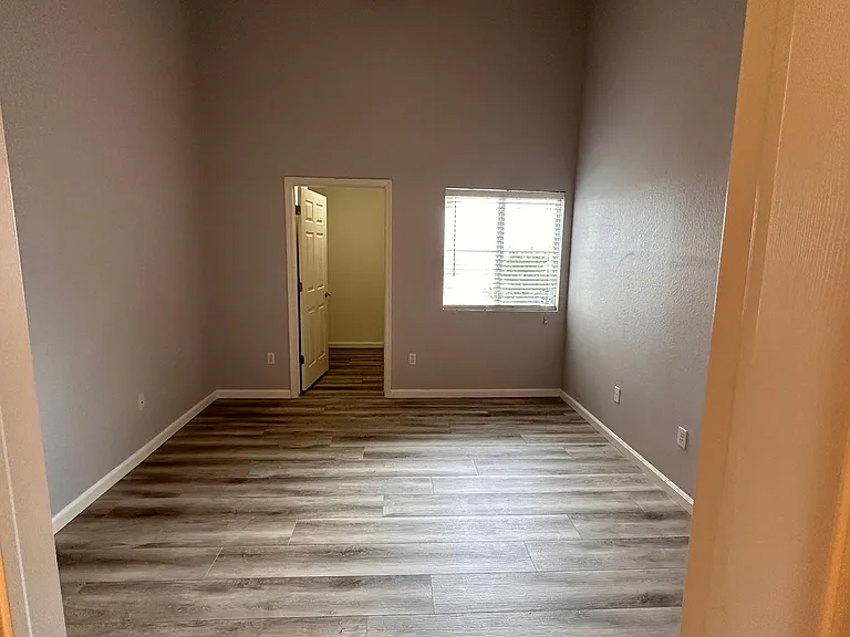 Another view of the bedroom with 18' ceiling and walk in closet.