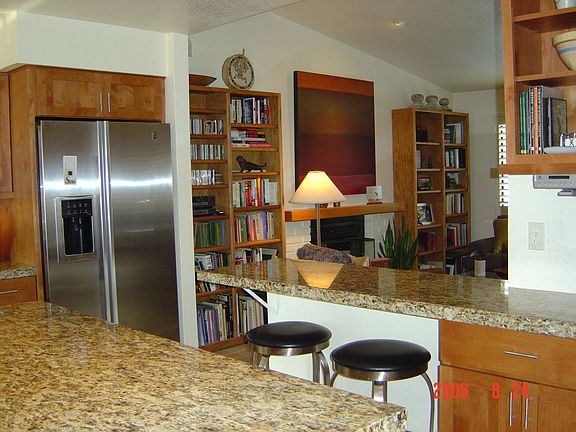 granite and stainless steel kitchen with office.