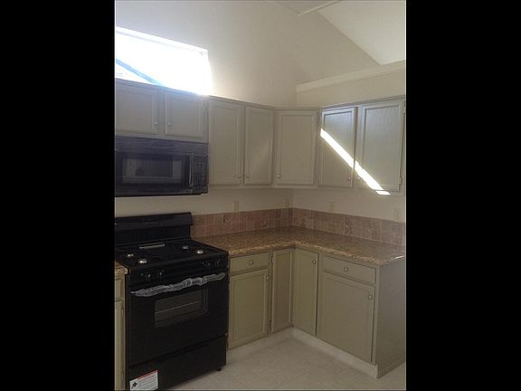 Lovely efficient Kitchen with tile floor, gas range, microwave and dishwasher