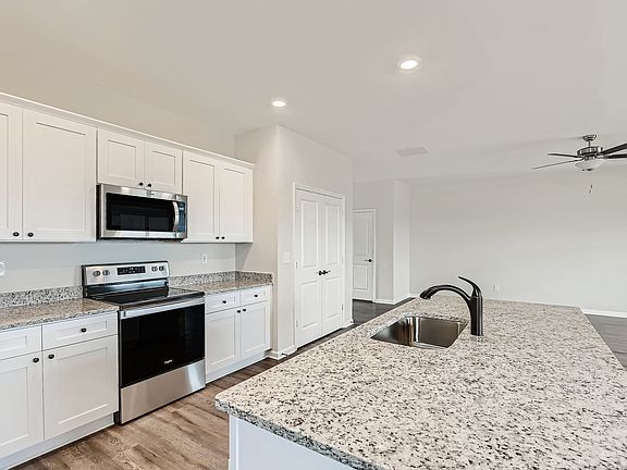 Love cooking in this kitchen with features like a large sink and expansive counterspace.