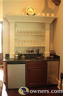 Custom built in with refrigerator and ice maker.