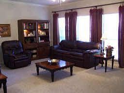 Spacious family room with lots of windows