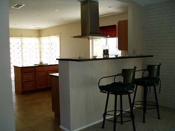 Breakfast bar with a floating hood.