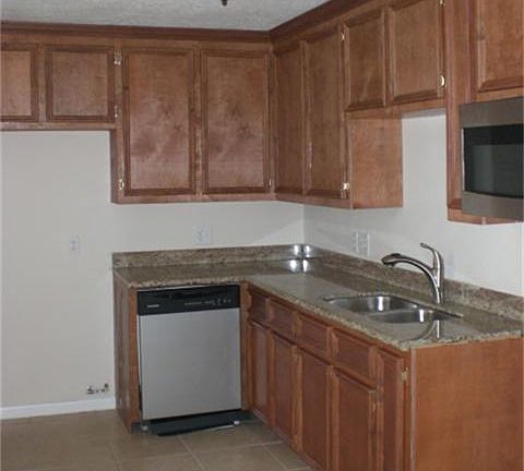 NEW TILE FLOORS AND GRANITE COUTER TOPS