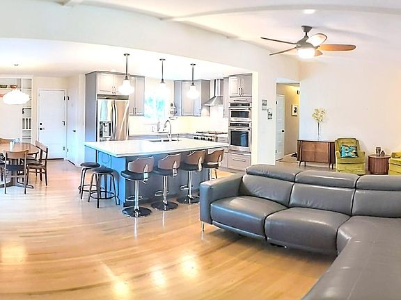 Chef's kitchen, dining, and living area.