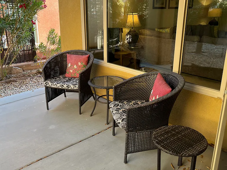 Sliders from dining area to backyard covered patio.