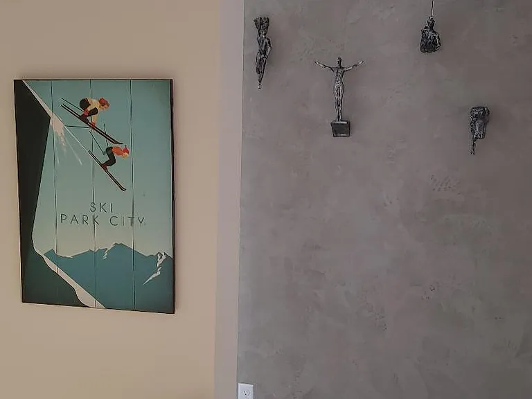Hallway leading to guest bedrooms, with specialty painted accent wall