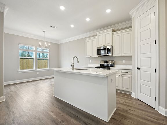 Kitchen in the Dune floorplan at a Meritage Homes community in Gulfport, MS.