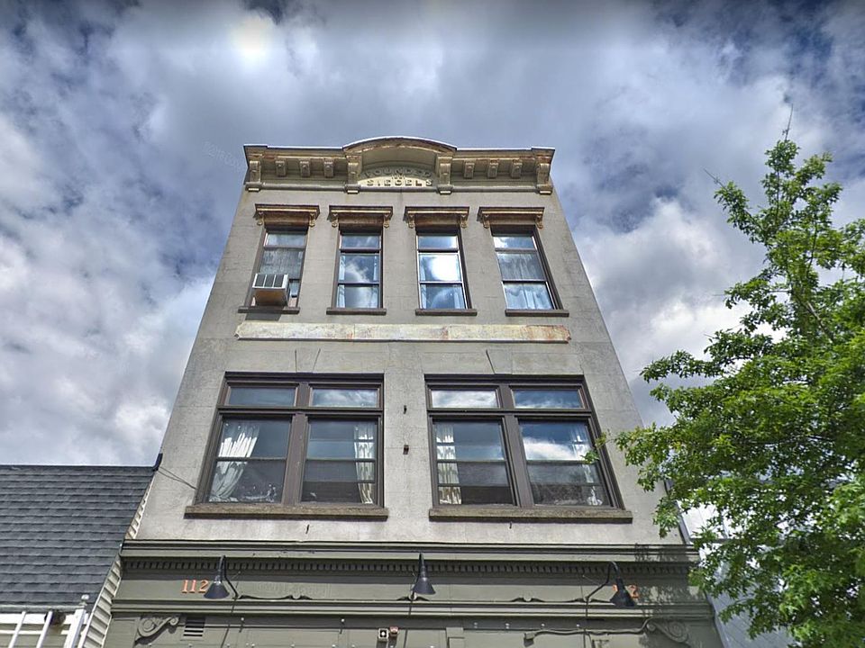 112 North Main St. The apartment is on the top floor with all of those beautiful windows! This building holds a lot of Port Chesters vibrant history.