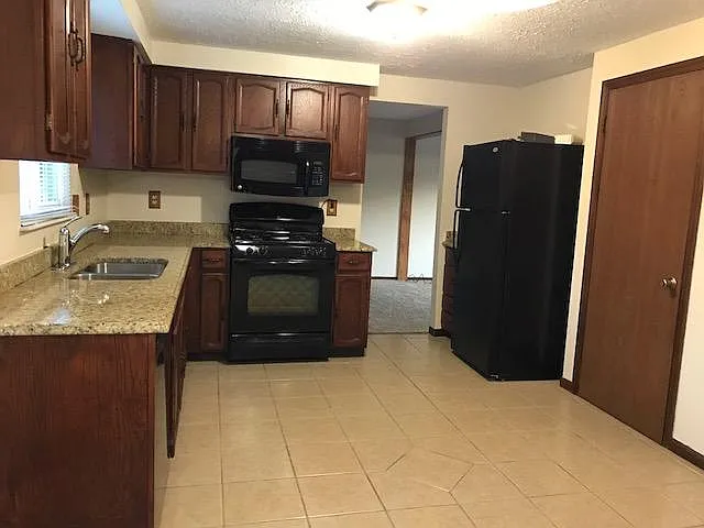 Kitchen with entry to dining room (basement steps on the right)