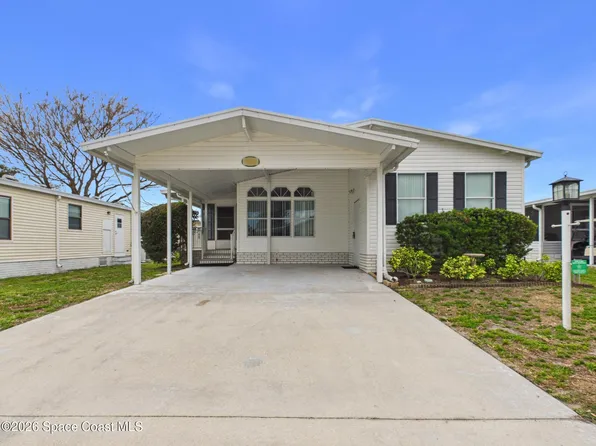 573 Dolphin Cir, Barefoot Bay, FL 32976