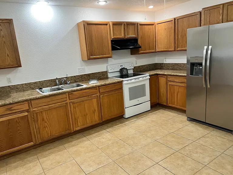 Kitchen with refrigerator