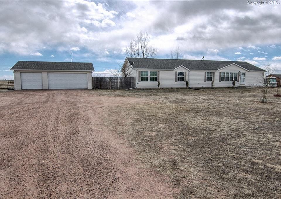 Front Exterior of home. Roomy 3-car garage.