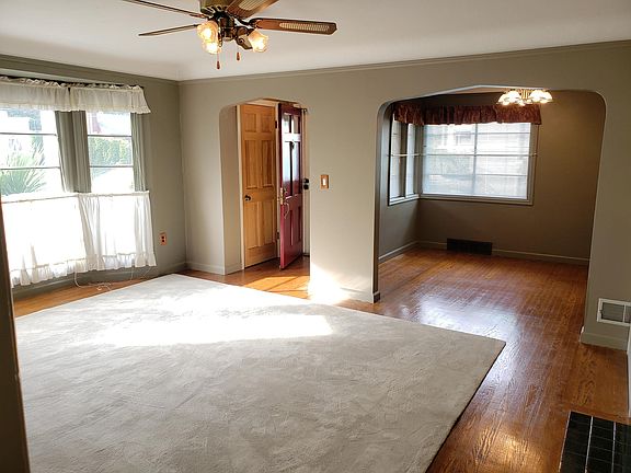 Living room w/fireplace and dining room in rear