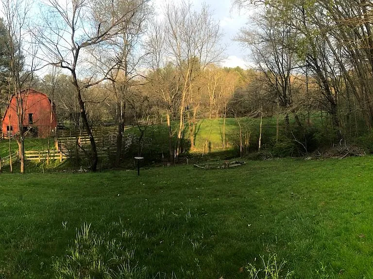 Panoramic of back yard, adjoins field with barn (neighboring property)
